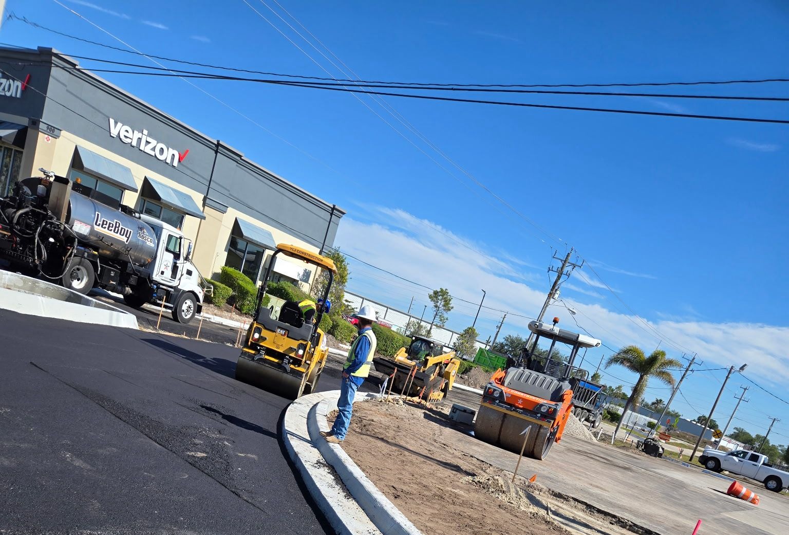 VLJ Construction crew paving a commercial parking lot
