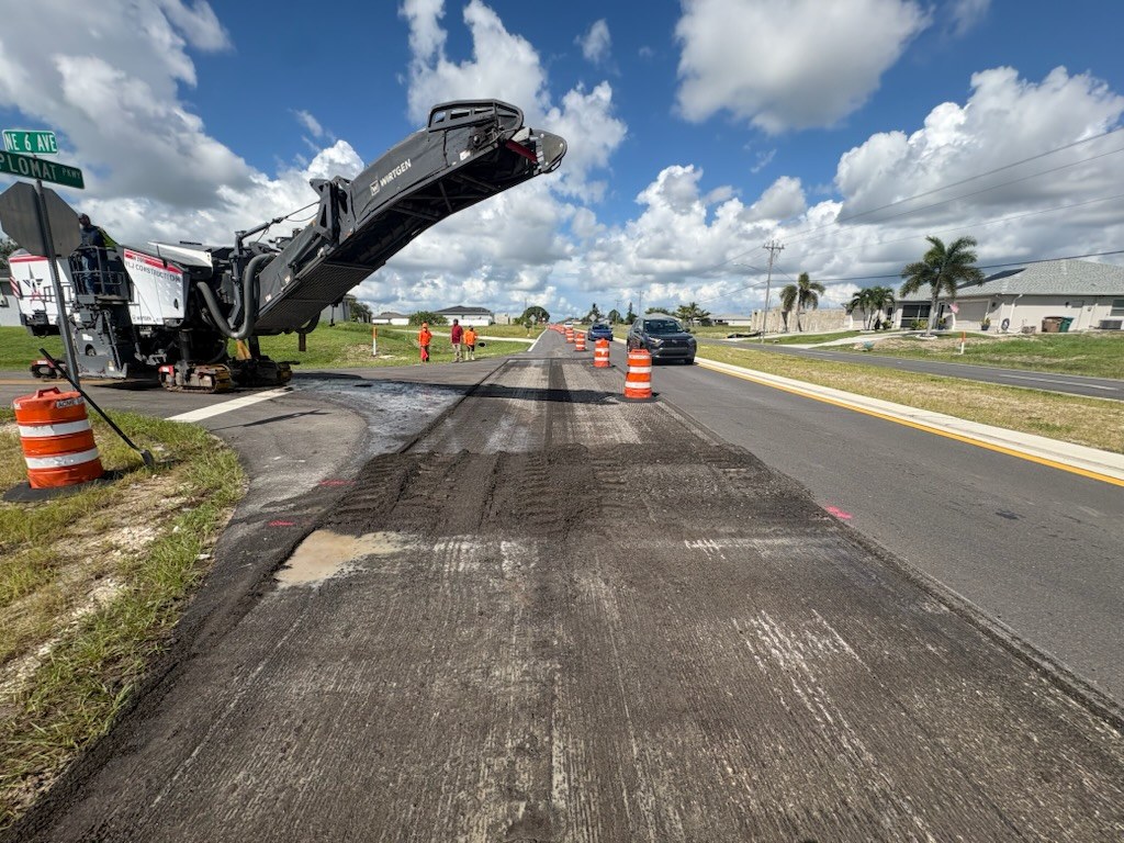 A freshly milled lane with the milling machine working ahead of it
