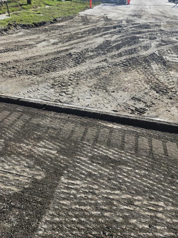 Close detail of a milled asphalt surface and its clean vertical edge
