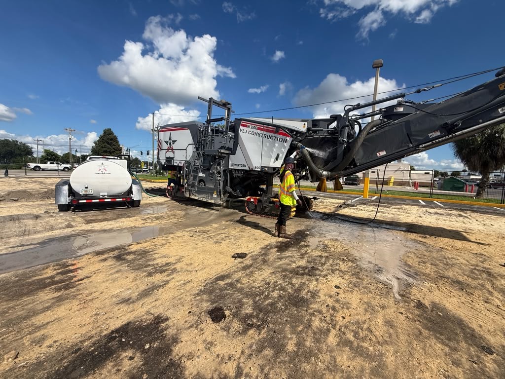 A VLJ Construction milling machine being washed down at the end of a shift