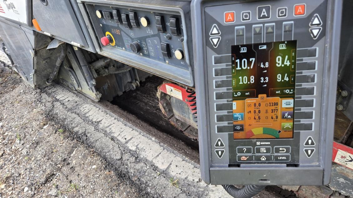 Depth readings on the control panel of a milling machine mid-cut